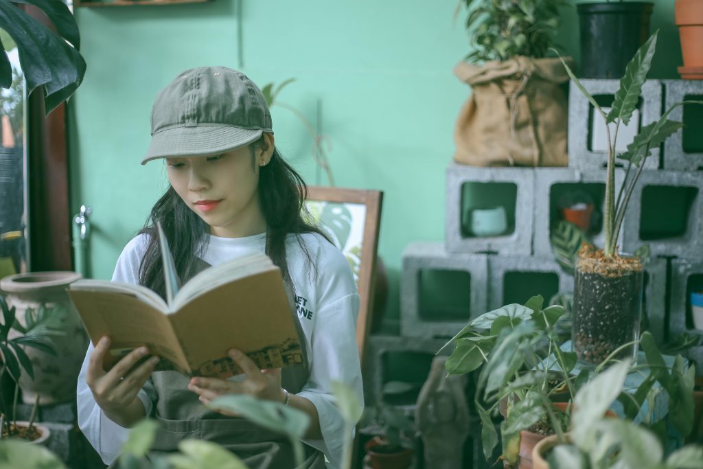 Seasonal Gardening - Gardner reading a book